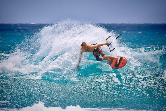 Kitesurfer riding a wave in the Caribbean 